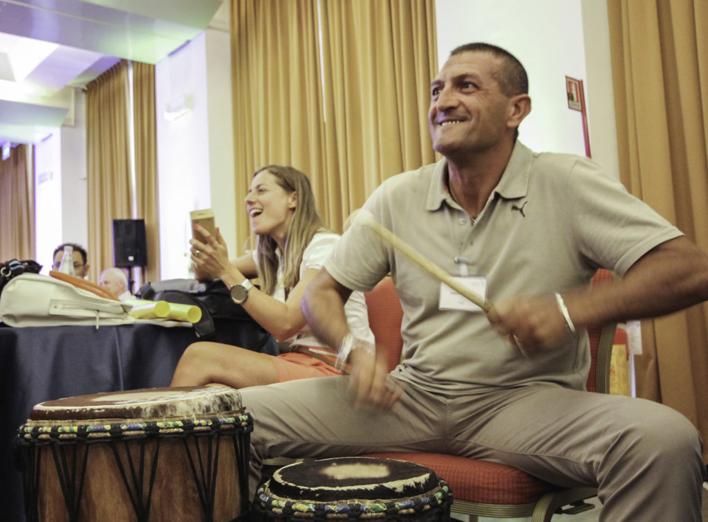 team building rhythm science drum circle corproate teambuilding benefits stress at work