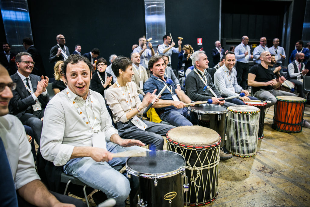 team building rhythm science drum circle corproate teambuilding benefits stress at work