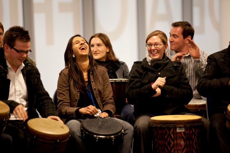 team building rhythm science drum circle corproate teambuilding benefits stress at work